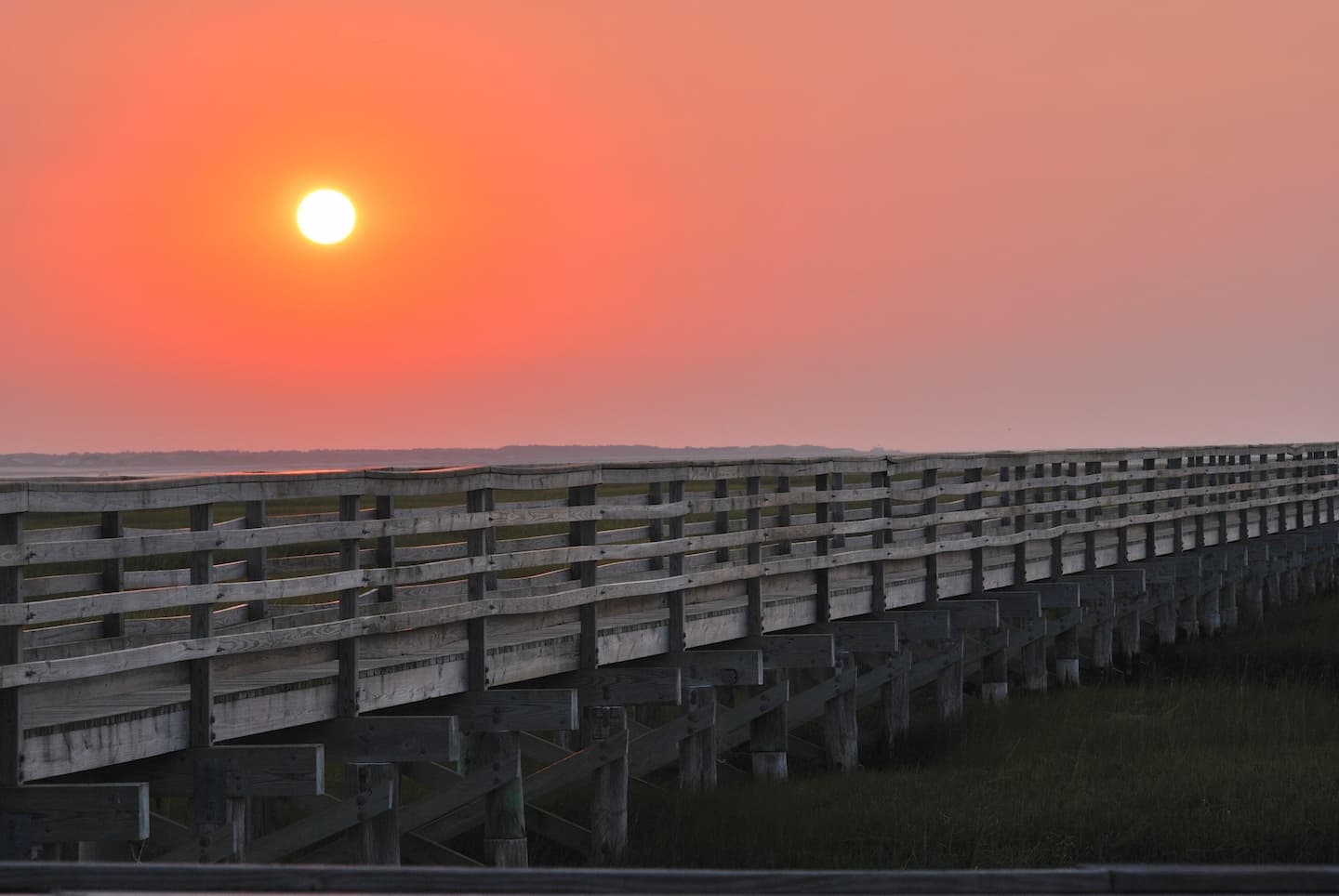 The sun setting over the Gray's Beach Boardwalk